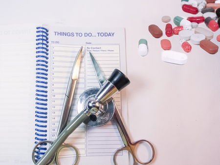 Stethoscope,planner,instruments and medines on the table isolated.の写真素材