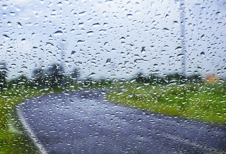 Natural water drop background.CAR Window glass with condensation of natural water drops .Abstract photo.Travelling and suddenly Rain breaks out giving me to capture this pictures. in the month of August.の写真素材