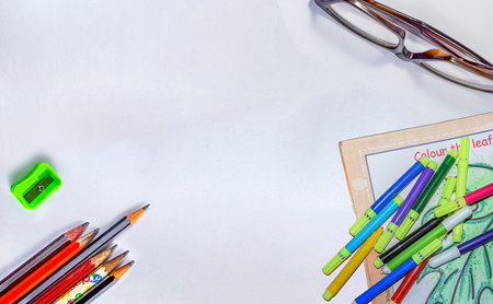 School supplies on a white background. View from above. Copy space.