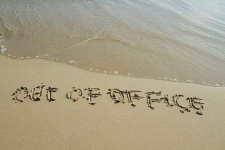 Handwritten in sand on a beach
