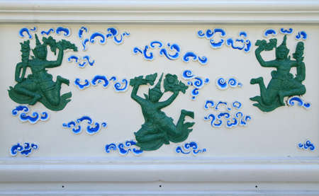 Traditional Thai style sculptures decorated on the wall の写真素材