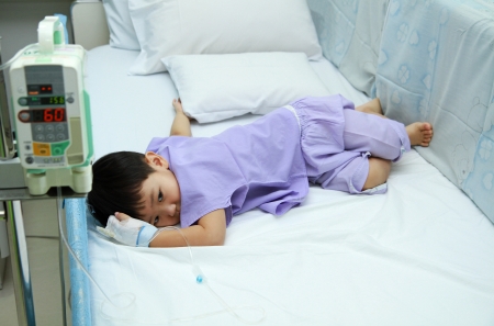 Children patient in hospital bed の写真素材