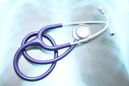 Close up image of stethoscope on top of x-ray filmの写真素材