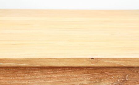 Wooden table with white wall backgroundの写真素材
