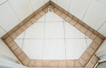 Dirty tiled floor in diamond shaped patternの写真素材