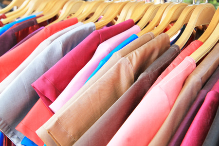 Thai silk clothes on hangersの写真素材