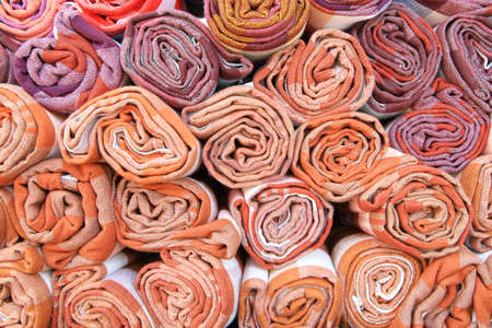Stacks of colorful Thai fabricの写真素材