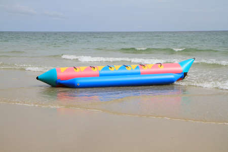 Colorful rubber boats on the beachの写真素材