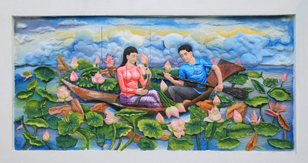 Stone carving and painting of Traditional Thai culture on temple wallの写真素材