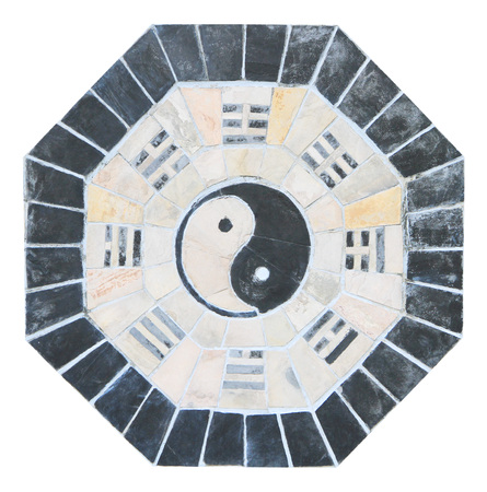 Yin yang sign on old tiled wallの写真素材