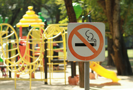 No smoking sign near children's playground in public parkの写真素材