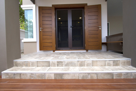 Main entrance of residential house with tiled floor and  stepsの写真素材