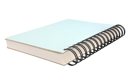 Green spiral notebook isolated on white backgroundの写真素材