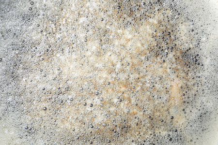 Surface of bubbles or lathers cover dirty water.の写真素材