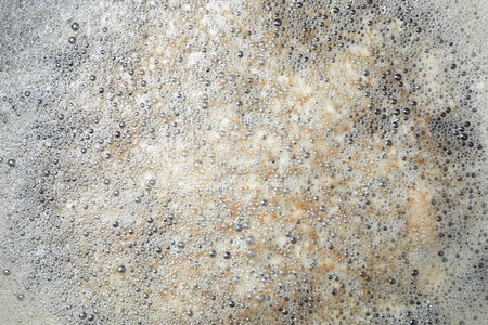 Surface of bubbles or lathers cover dirty water.の写真素材