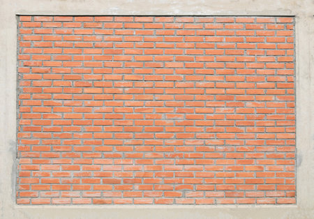 Red bricks wall with cement frameの写真素材