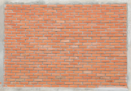 Red bricks wall with cement frameの写真素材