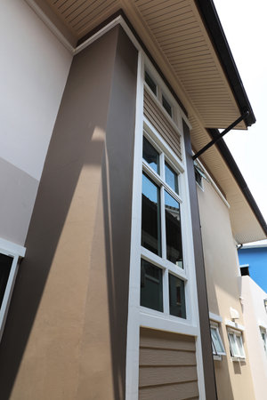 Exterior of modern house with window, roof and ceiling and rain gutter.の写真素材
