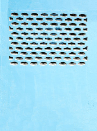 Blue vent brick wall. Exterior building wall with air vent.