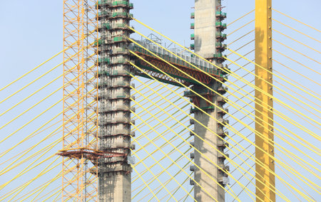 Yellow cables of under construction suspension bridge