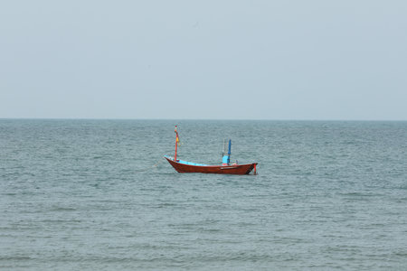 Colorful fishing boat floating on the sea.
