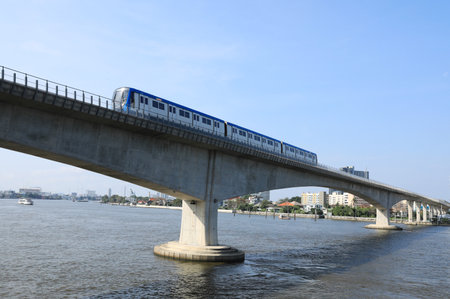 BANGKOK, THAILAND - FEBRUARY 12 : Chaloem Ratchamongkon Line or MRT Blue Line running crossing Chao Phraya river on February 12, 2023 in Bangkok, Thailand.のeditorial素材