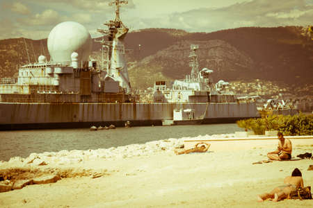 Aircraft carrier "Charles de Gaulle" in the port of Toulon. In the background you see the town Toulon and the immense mountains of the coast of the French Riviera.のeditorial素材