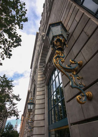 Two street bronze lights on buildingのeditorial素材