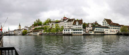 ZURICH, SWITZERLAND - APRIL 19, 2014: Panoramic view of river Limmat embankment at city historical center in Zurich on April 19, 2014.のeditorial素材