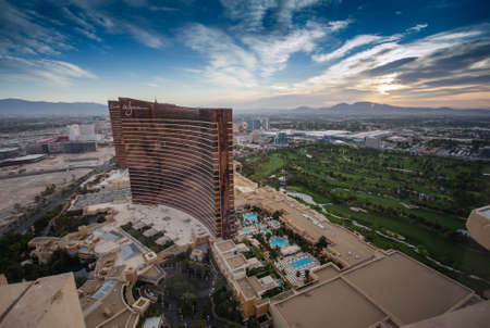 LAS VEGAS, NEVADA, USA - MAY 5, 2014: Working round-the-clock modern Vegas hotels and casinos Wynn and Encore at sunrise aerial view scene in Las Vegas, Nevada on May 5, 2014.のeditorial素材