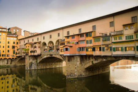 FLORENCE, ITALY - SEPTEMBER 11, 2008: Ponte Vecchio in Florence, Italy on September 11, 2008. It is a Medieval stone arch bridge over the Arno River with shops built along itのeditorial素材