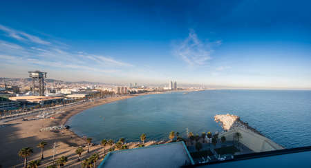 BARCELONA, SPAIN - NOVEMBER 10, 2015: Panoramic view of city seascape with San Sebastian, San Miguel and Barceloneta beaches on November 10, 2015 in Barcelona, Spain.のeditorial素材