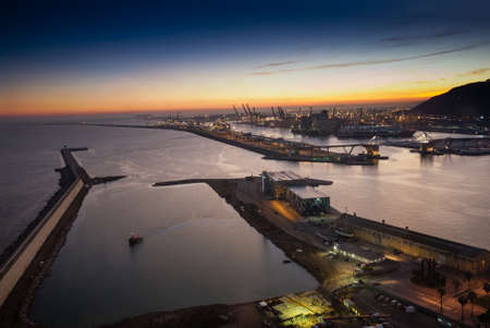 BARCELONA, SPAIN - NOVEMBER 10, 2015: Panoramic view of the Adossat cruise wharf and cargo port of Barcelona on November 10, 2015 in Barcelona, Spain. It is Catalonia's largest port.のeditorial素材