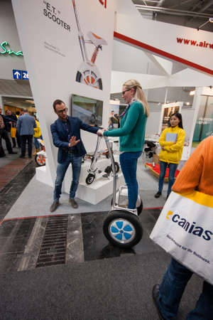 HANNOVER, GERMANY - MARCH 14, 2016: Attendee tests Segway displayed at CeBIT information technology trade show in Hannover, Germany on March 14, 2016.のeditorial素材