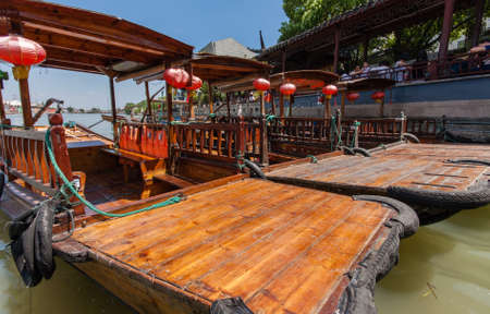 ZHUJIAJIAO, CHINA - AUGUST 30, 2016: Chinese gondolas waits Tourists on canal of ancient water town with a history of more than 1700 years in Zhujiajiao, China, on August 30, 2016.のeditorial素材