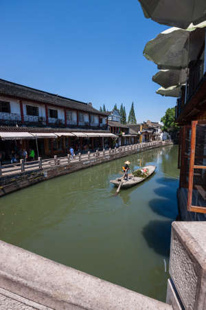 ZHUJIAJIAO, CHINA - AUGUST 30, 2016: Working boat on canal of ancient water town in Zhujiajiao, China, on August 30, 2016. It is Chinese Venice near Shanghai with a history of more than 1700 years.のeditorial素材