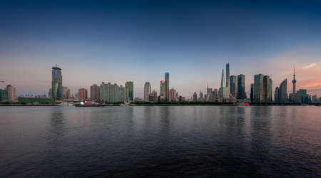 SHANGHAI, CHINA - AUGUST 29, 2016: Twilight panoramic view of Shanghai skyline and the Huangpu river against Pudong District, Shanghai, China on August 29, 2016.のeditorial素材