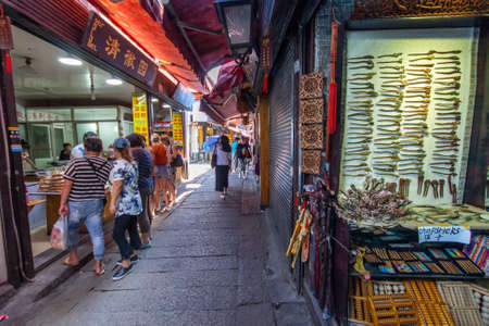 ZHUJIAJIAO, CHINA - AUGUST 30, 2016: An unidentified people are shopping at market street of ancient water town with a history of more than 1700 years in Zhujiajiao, China, on August 30, 2016.のeditorial素材