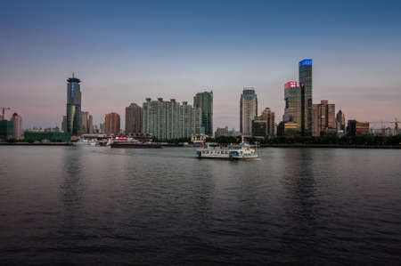 SHANGHAI, CHINA - AUGUST 29, 2016: Twilight view of Shanghai skyline and the Huangpu river, Shanghai, China on August 29, 2016.のeditorial素材