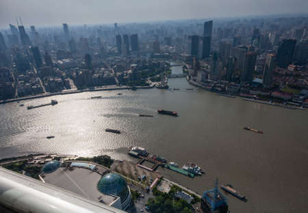 SHANGHAI, CHINA - AUGUST 29, 2016: Aerial view of Shanghai Bund district and the Huangpu river in Shanghai, China on August 29, 2016.のeditorial素材