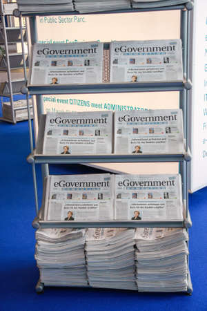 HANNOVER, GERMANY - MARCH 2, 2010: Bookstand with eGovernment newspaper in hall at CeBIT trade show in Hannover, Germany on March 2, 2010.のeditorial素材