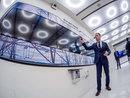 MOSCOW, RUSSIA - APRIL 3, 2018: Huawei Russia manager presents demo stand Smart Grid at event opening OpenLab department on April 3, 2018 in Moscow, Russia.のeditorial素材