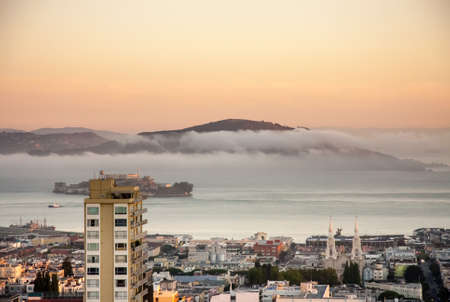 SAN FRANCISCO, USA - SEPT 24, 2008: Aerial view to city and bay area with abandoned prison on Alcatraz Island on sunrise on Sept 24, 2008 in San Francisco, USA.のeditorial素材