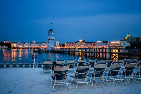 ORLANDO, FL, USA - JUNE 6, 2011: Illuminated embankment at Boardwalk Disney  area on Crescent Lake shore at night in Orlando on June 6, 2011.のeditorial素材