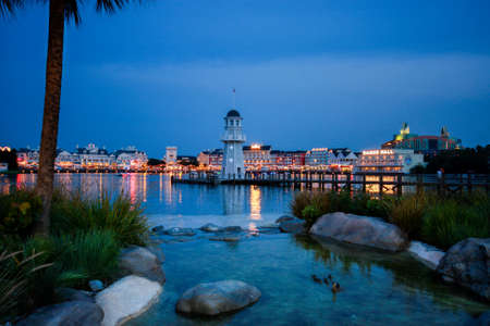 ORLANDO, FL, USA - JUNE 6, 2011: Illuminated embankment at Boardwalk Disney  area on Crescent Lake shore at night in Orlando on June 6, 2011.のeditorial素材