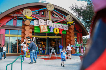 ORLANDO, FLORIDA - JANUARY 19, 2009: People go to entrance of Once Upone a Toy shop in Downtown Disney in Orlando, Florida on January 19, 2009.のeditorial素材