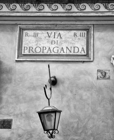 Symbolic street sign Propaganda on painted stucco wallの写真素材