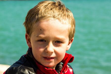 Boy standing outside.の写真素材