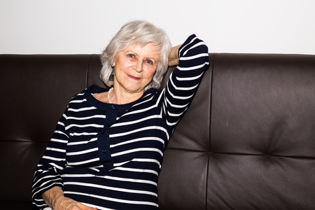 A  senior woman showing that she enjoys retirement by relaxing.の写真素材