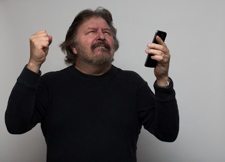 Senior man is happy to text first time.の写真素材